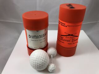 Fakini.Diminishing Golf ball with package tube.2.jpeg
